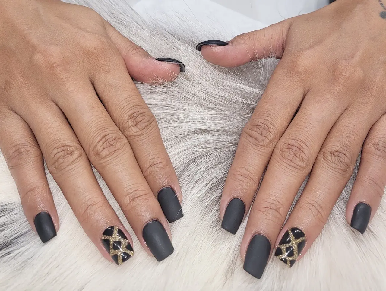 Matte charcoal nails with leopard accents